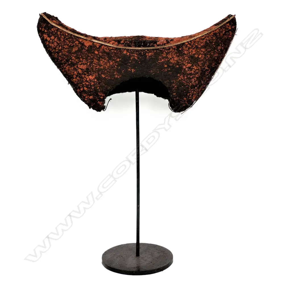 A PNG Huli Tribe bachelor's headdress of red ochre-stained human hair, typical crescent form. With iron stand. W.420mm Image 1++